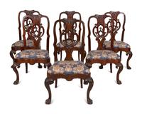 A Set of Twelve Continental Walnut Dining Chairs