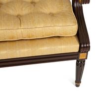 A French Empire Style Mahogany and Parcel Gilt Fauteuil