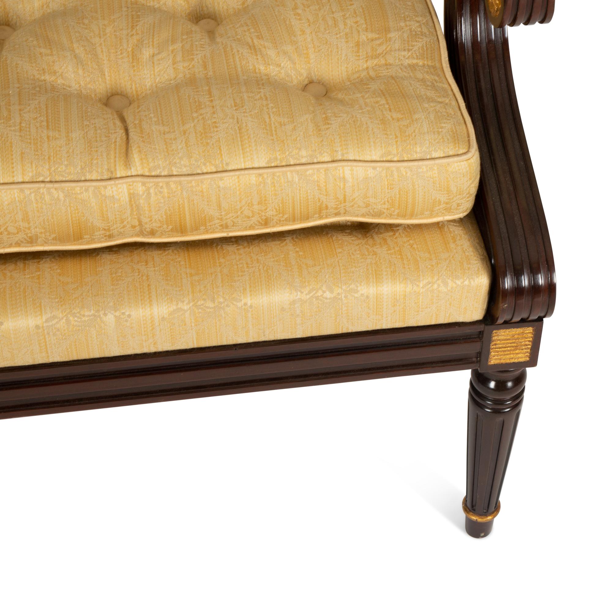 A French Empire Style Mahogany and Parcel Gilt Fauteuil