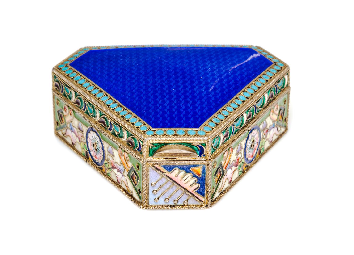 A Russian Jeweled Guilloche Enamel and Silver Box, 20th Artel, Moscow, 1908-1926, of triangular form with canted corners.