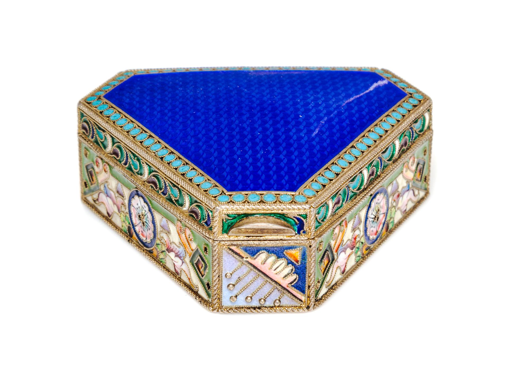 A Russian Jeweled Guilloche Enamel and Silver Box, 20th Artel, Moscow, 1908-1926, of triangular form with canted corners.
