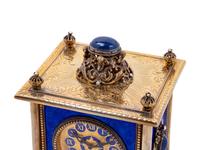 A Continental Blue Hardstone and Cultured Pearl Inset Gilt Metal and Enameled Table Clock