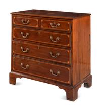 An English Mahogany and Marquetry Chest of Drawers