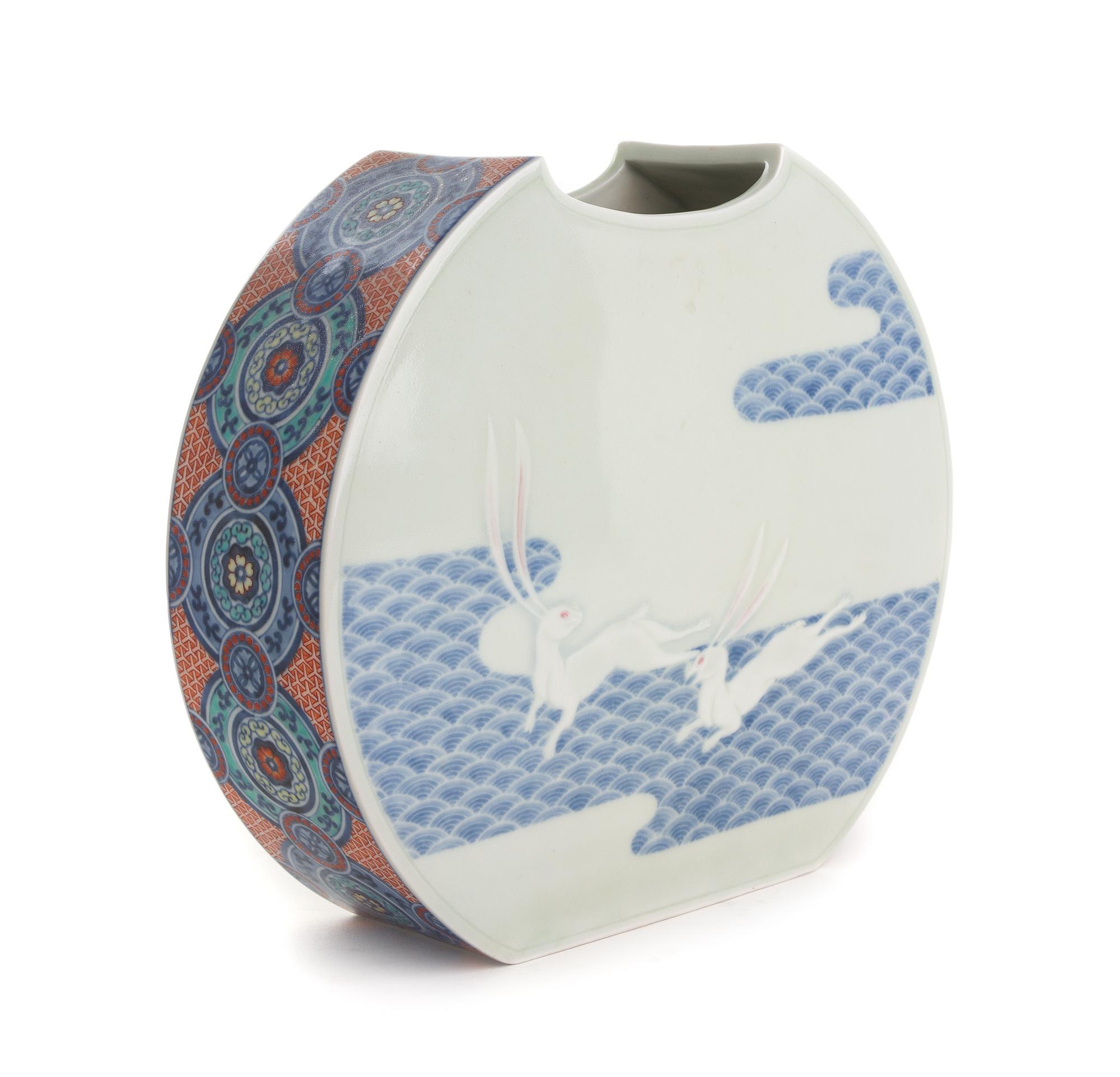 A Japanese Polychrome and Underglaze Blue Porcelain Vase Height 9 inches.