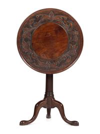 A Carved Walnut Dished-Top Tea Table