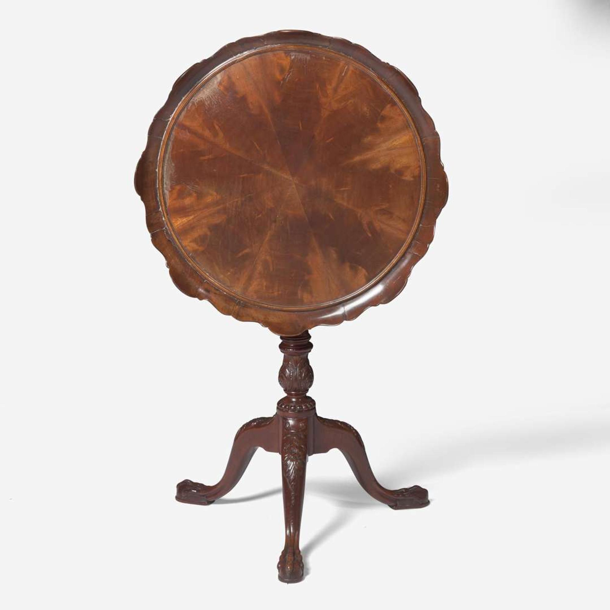 A George III carved mahogany tilt-top candlestand circa 1760