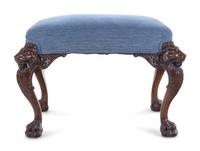 An Edwardian Carved Mahogany Foot Stool