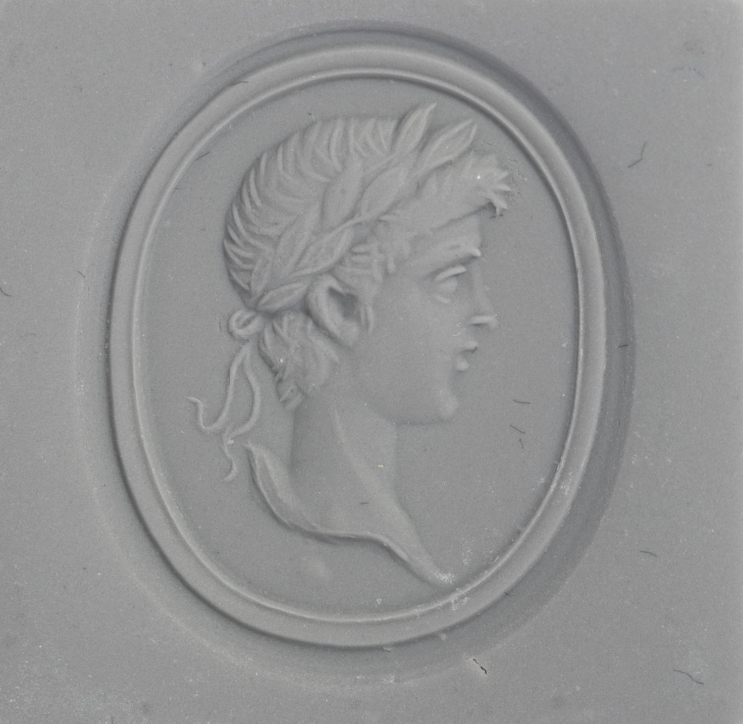 A Neoclassical Gold and Carnelian Finger Ring with a Male Portrait Head