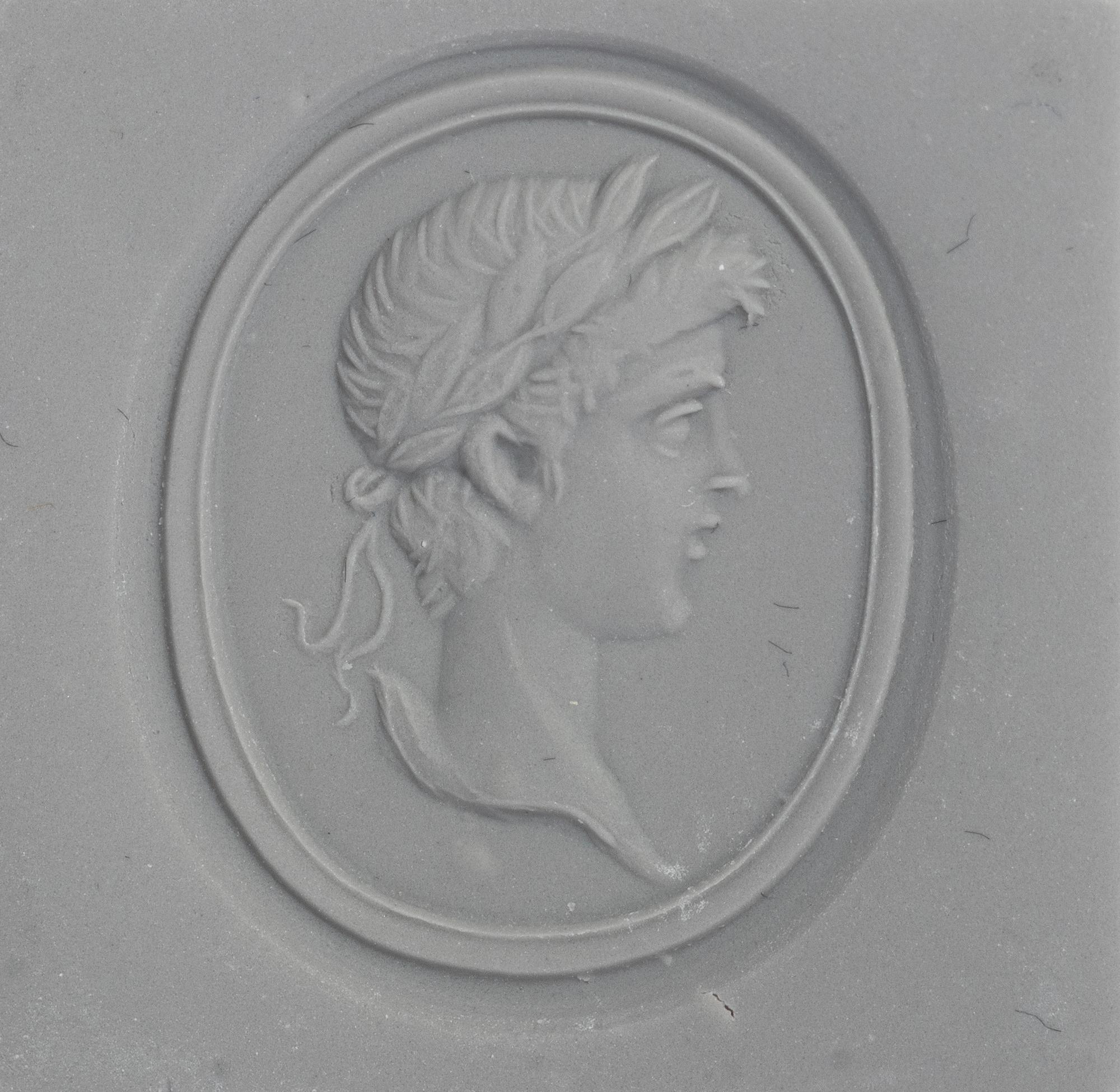 A Neoclassical Gold and Carnelian Finger Ring with a Male Portrait Head