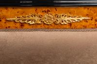 A Pair of Directoire Style Parcel Ebonized Burlwood Settees