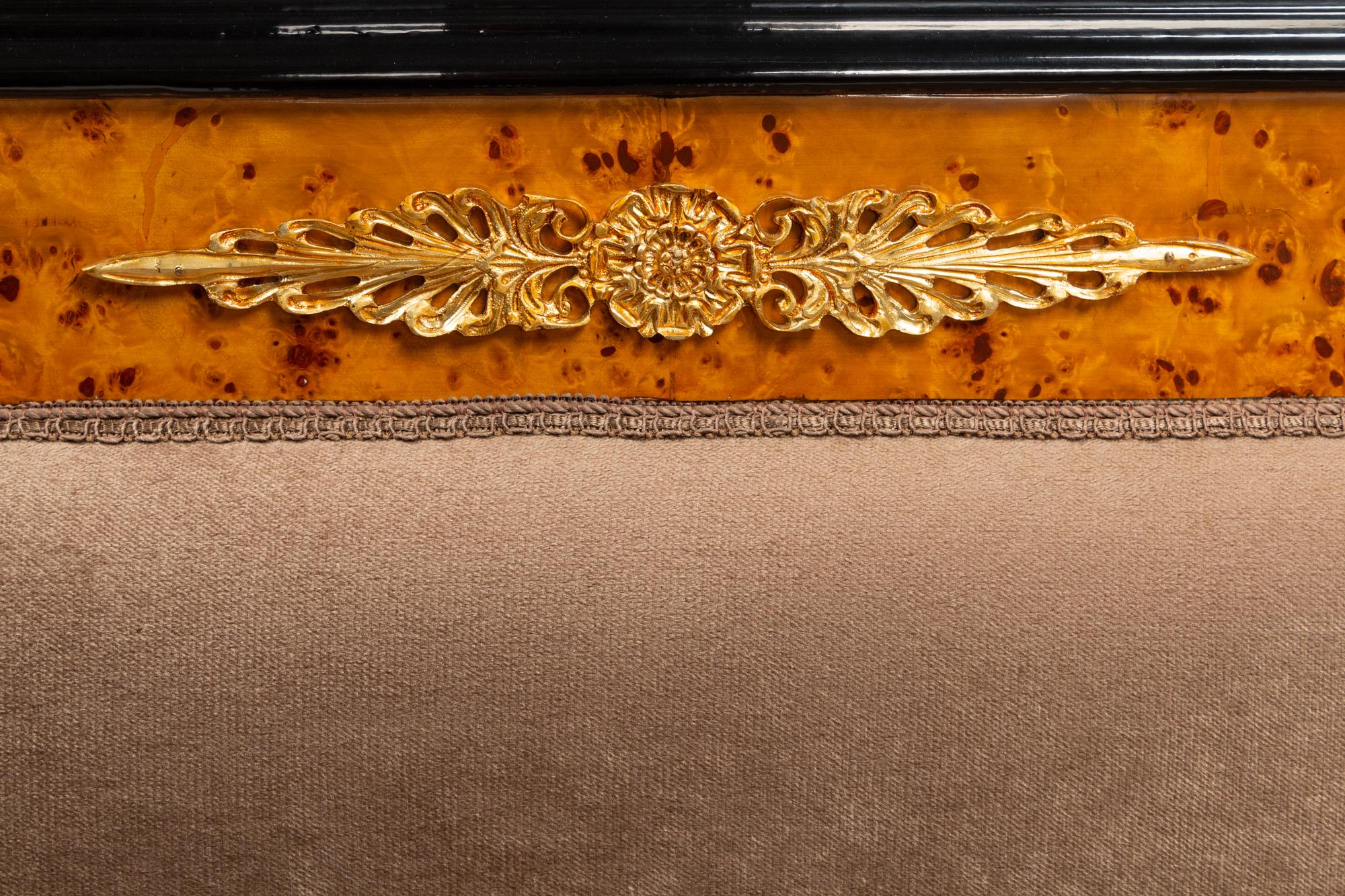 A Pair of Directoire Style Parcel Ebonized Burlwood Settees