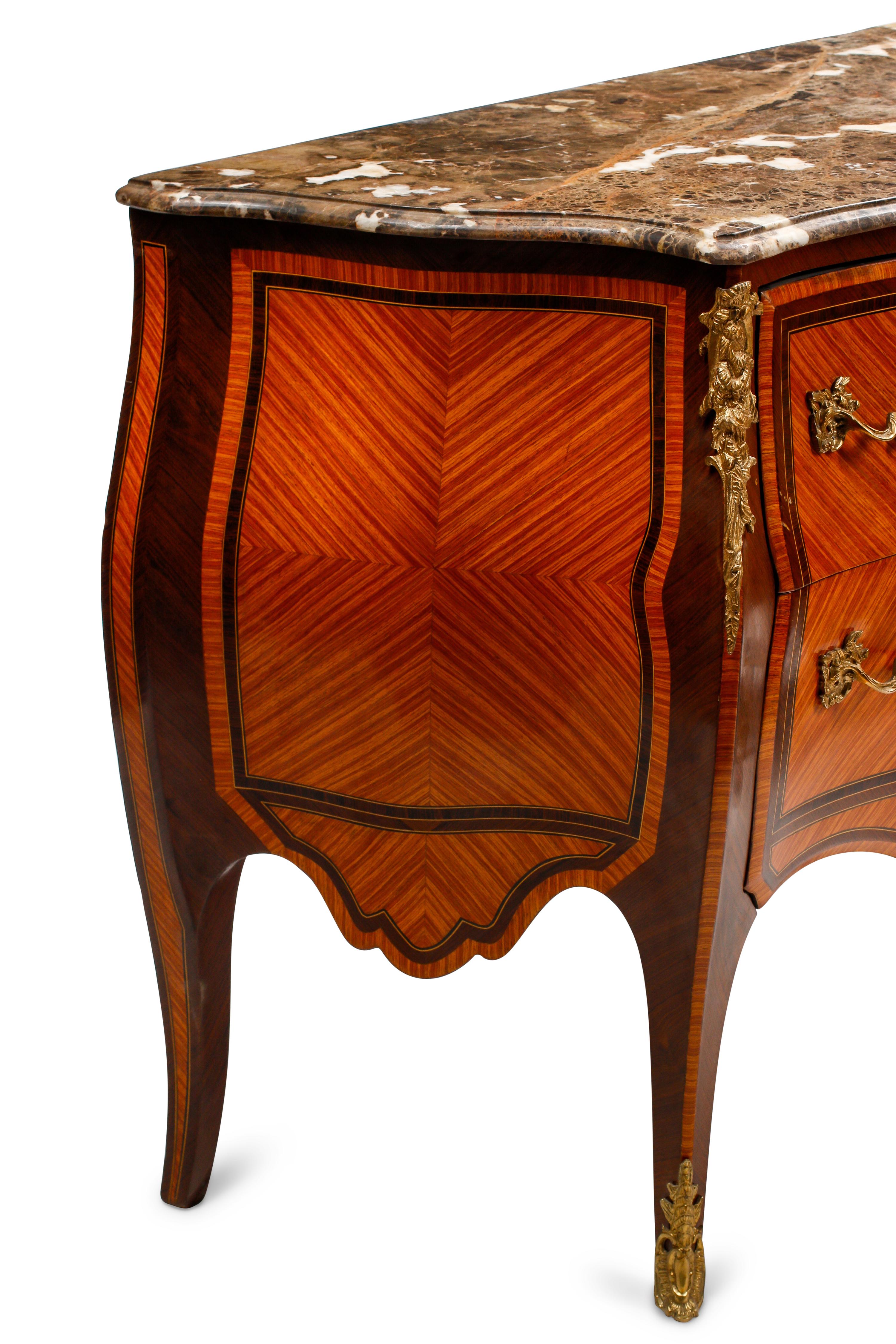 A Pair of Louis XV Style Bookmatch Veneered and Gilt Bronze Mounted Marble-Top Commodes