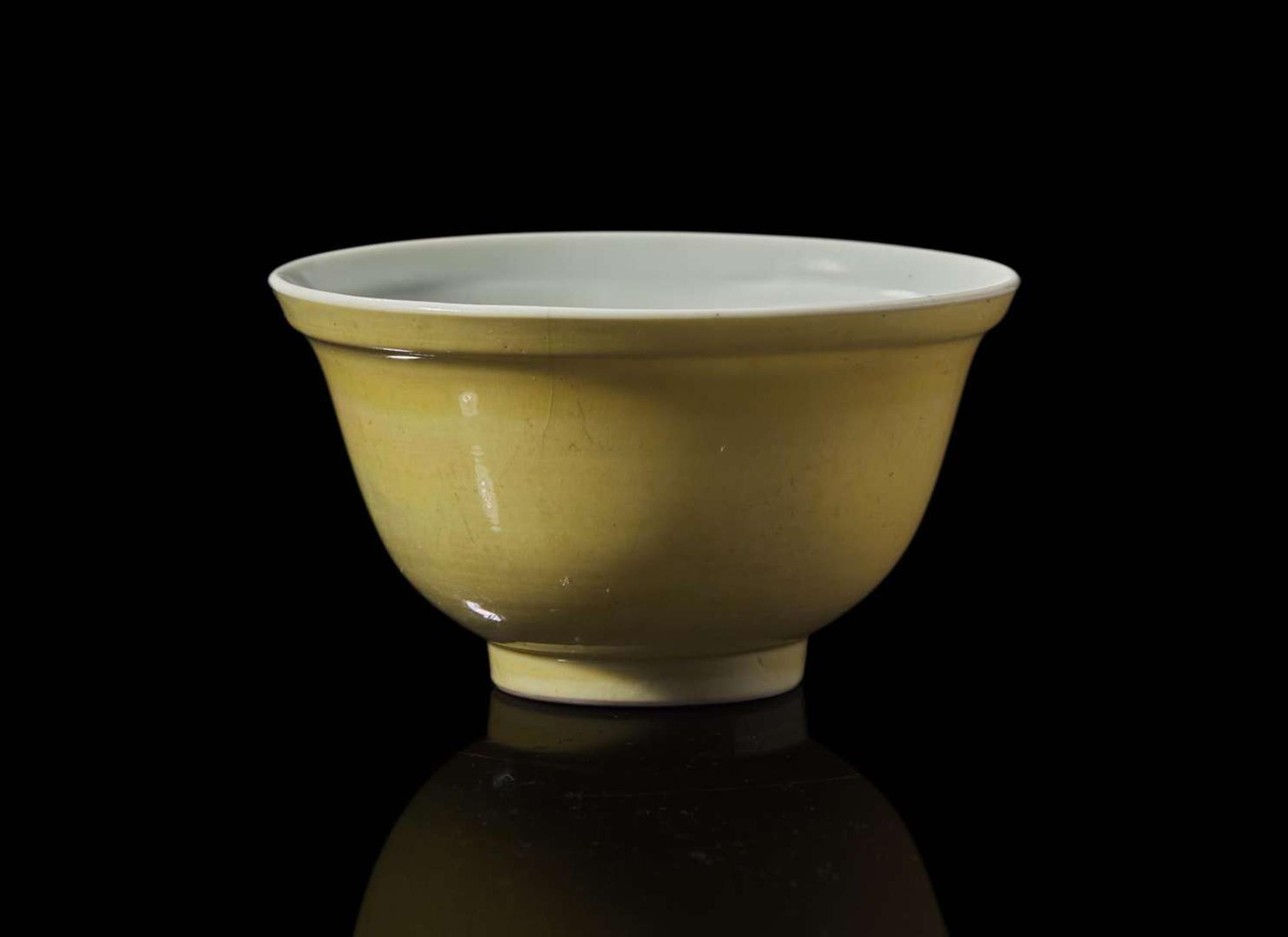 A Chinese yellow glazed small bowl, Yongzheng six-character mark and of the period 黃釉茶杯 雍正六字款 清雍正