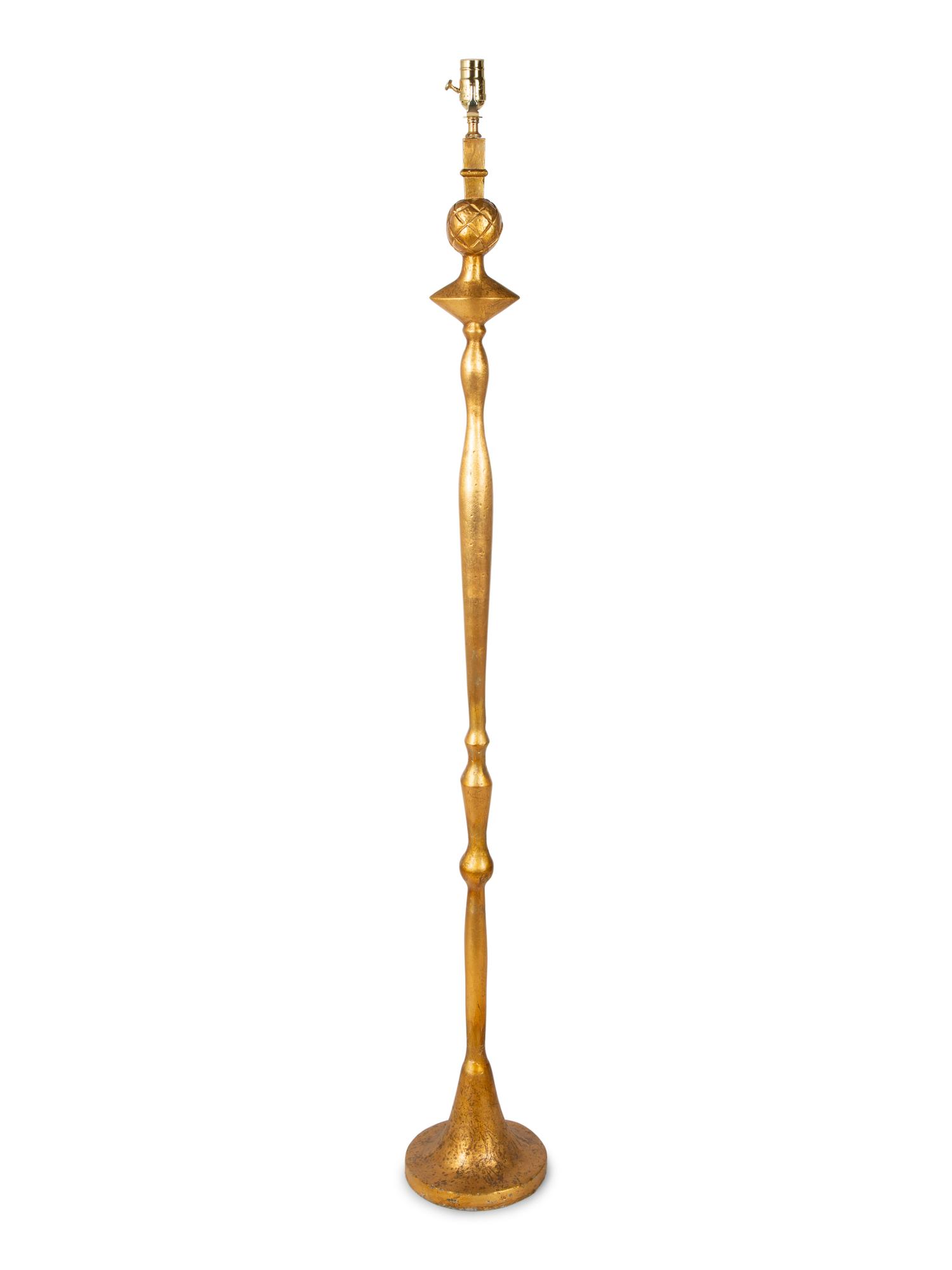 A Gilt Lead Floor Lamp — CIRCA 1930