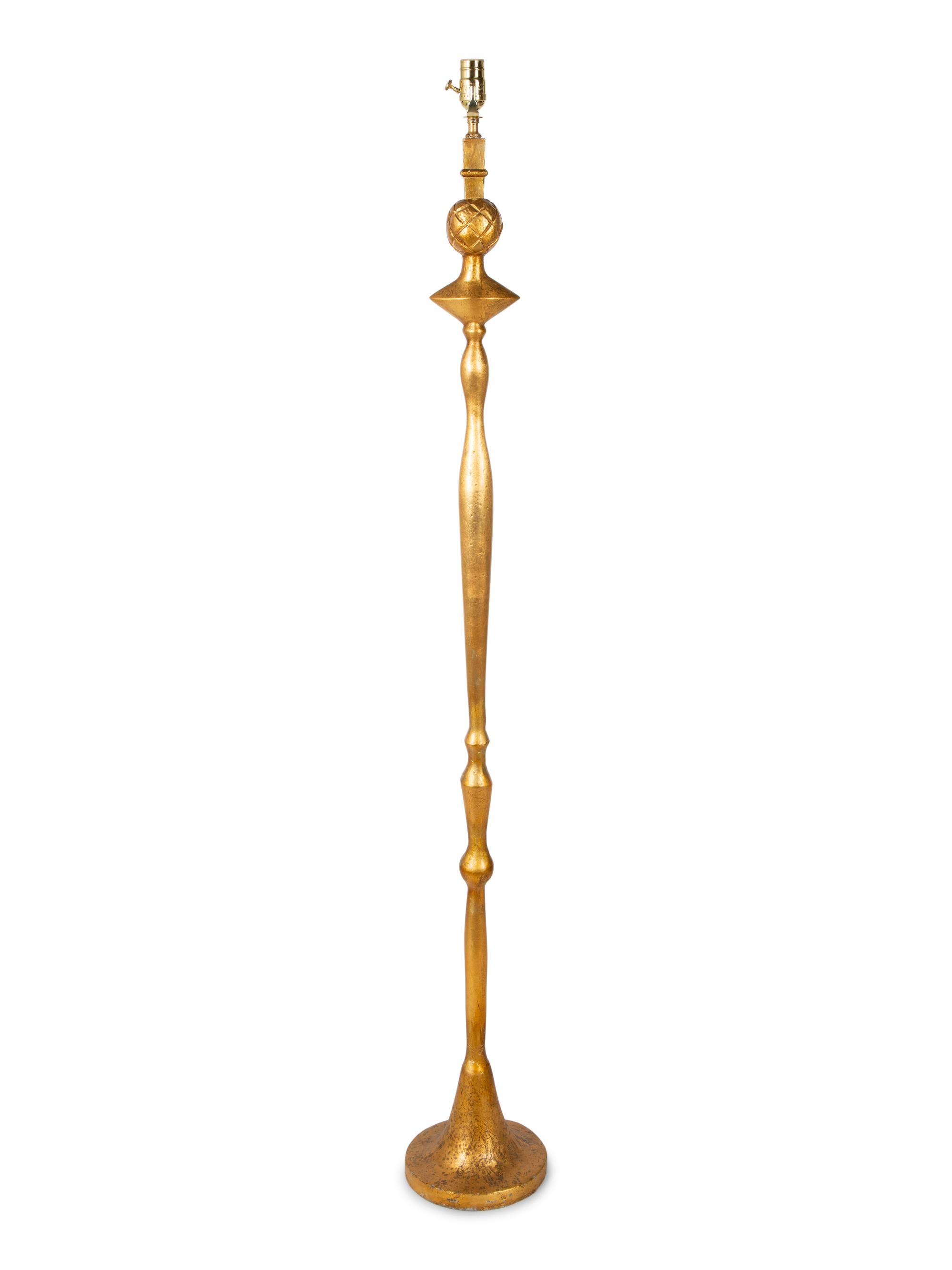 A Gilt Lead Floor Lamp — CIRCA 1930