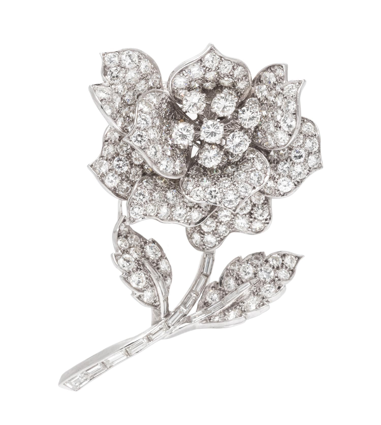 A Platinum and Diamond Flower Brooch, 21.00 dwts.