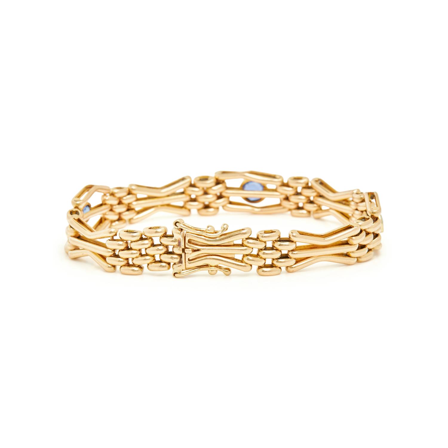 YELLOW GOLD, SYNTHETIC SAPPHIRE, AND DIAMOND BRACELET