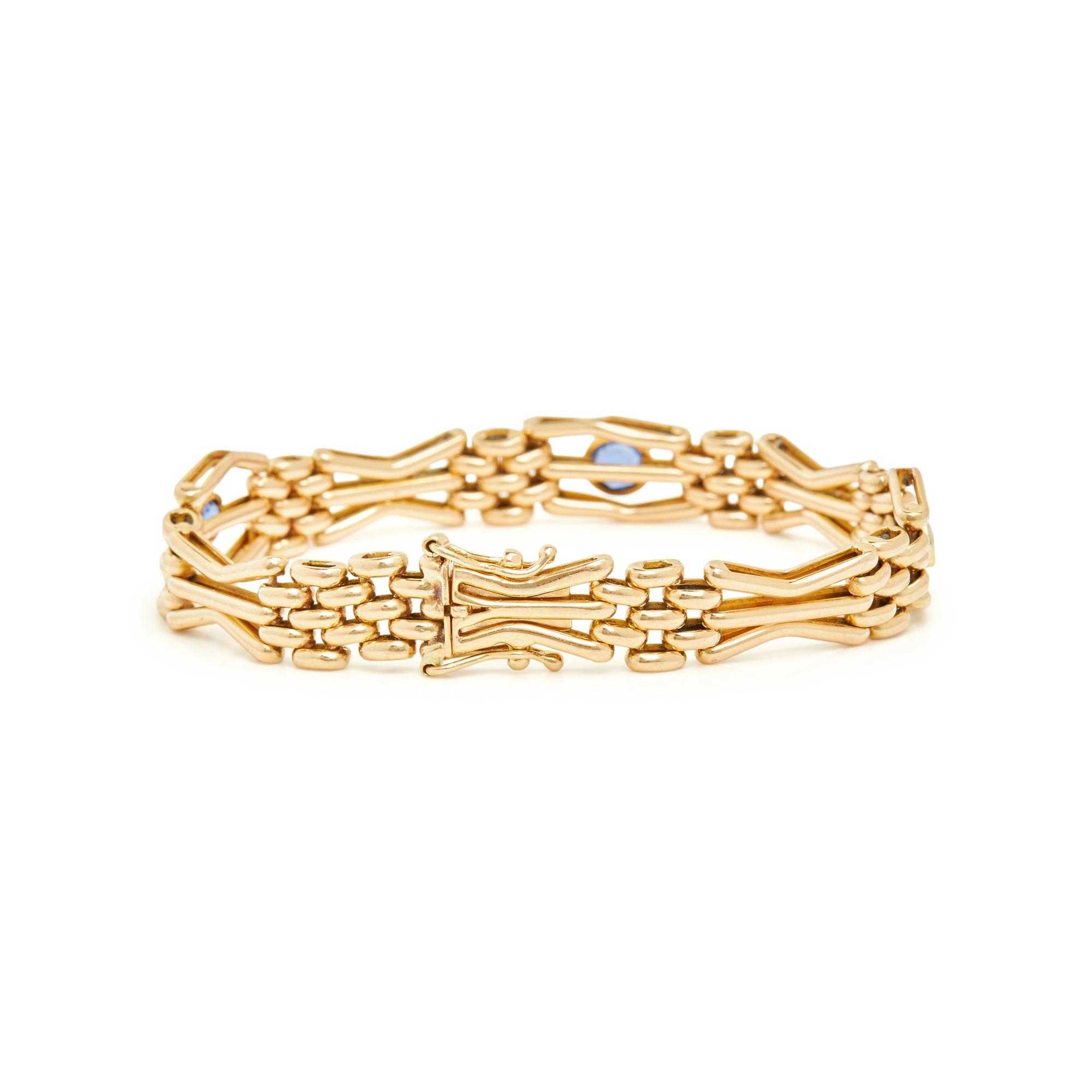 YELLOW GOLD, SYNTHETIC SAPPHIRE, AND DIAMOND BRACELET