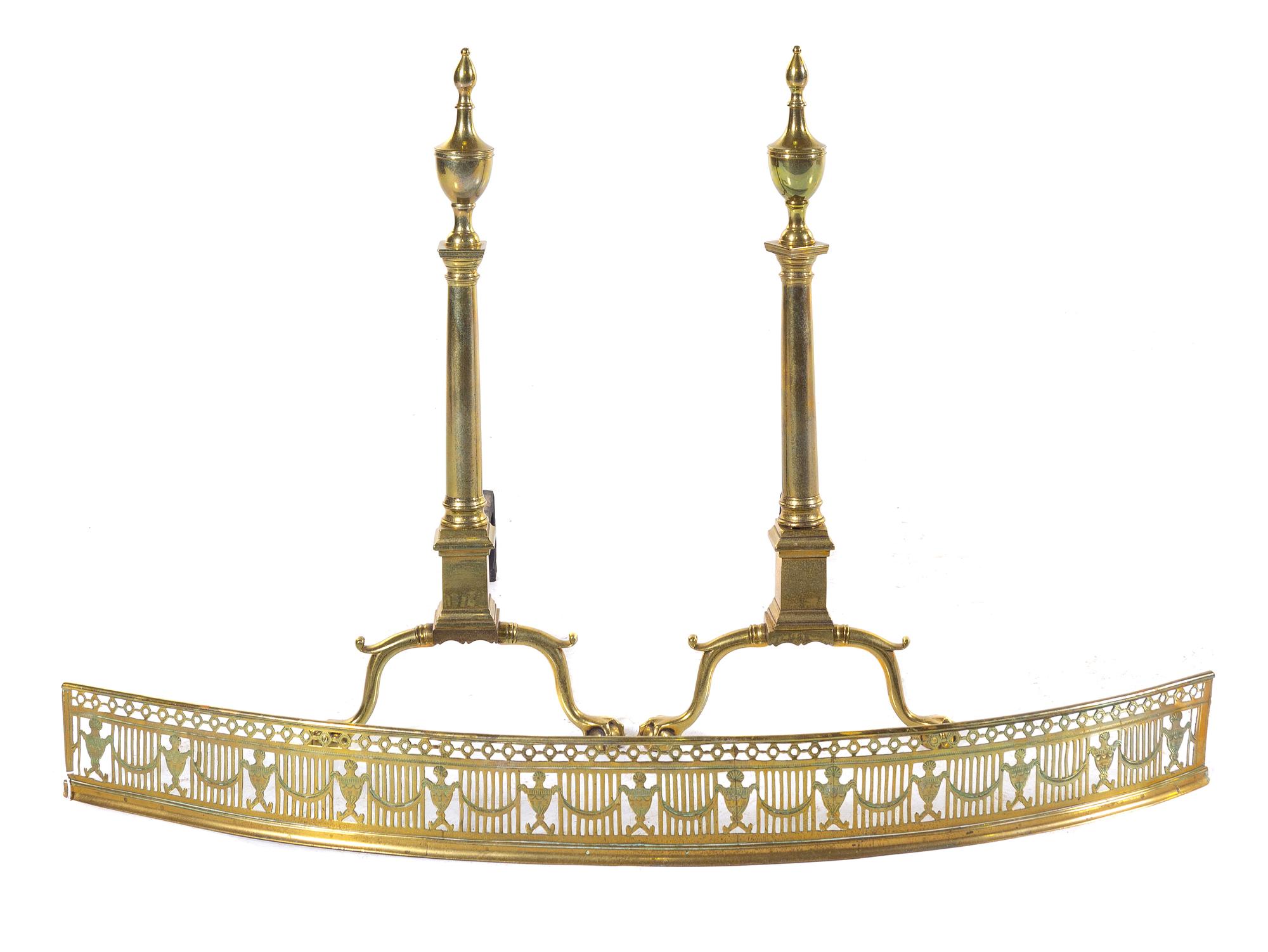 A Pair of Colonial Style Brass Andirons and an Associated Brass Fender Height of andirons 29 1/2 inches. — 18TH/19TH CENTURY