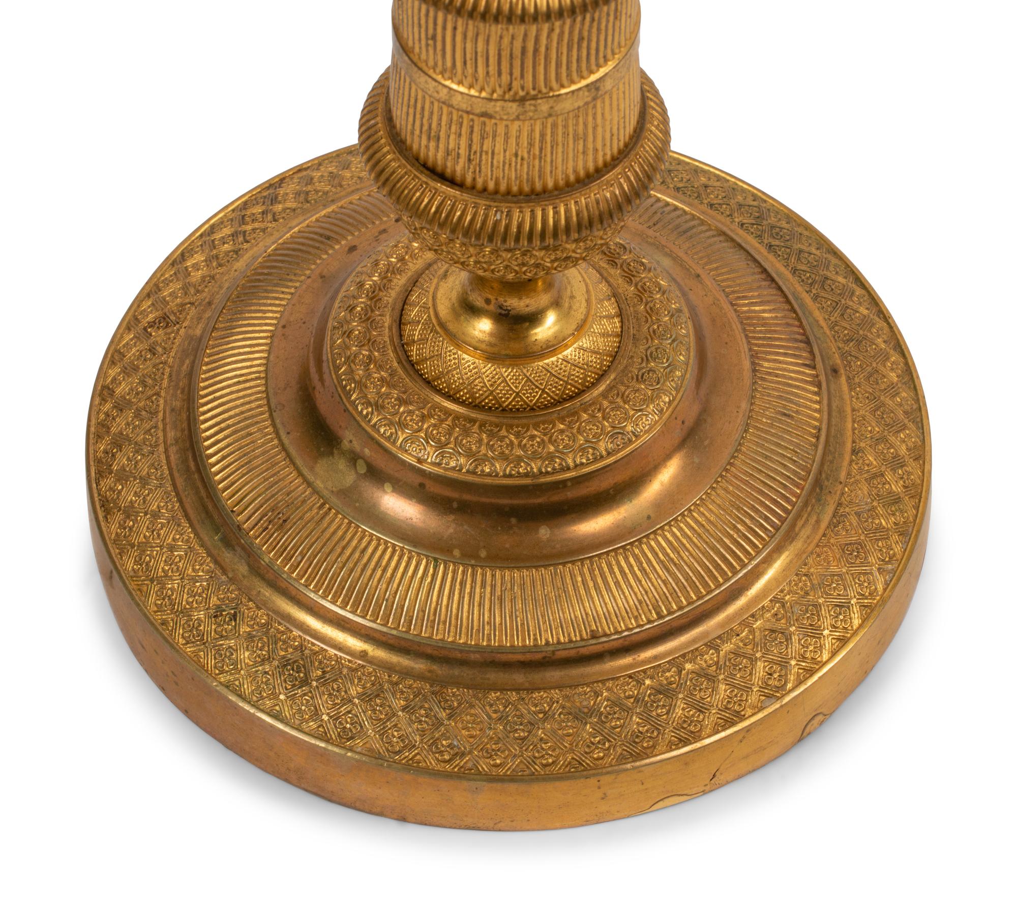 A Pair of Empire Style Gilt and Patinated Bronze Four-Light Candelabra
