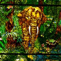 A Mark Bogenrief "Jungle" Stained Glass Window 115.5" W x 140" H — United States, 2015