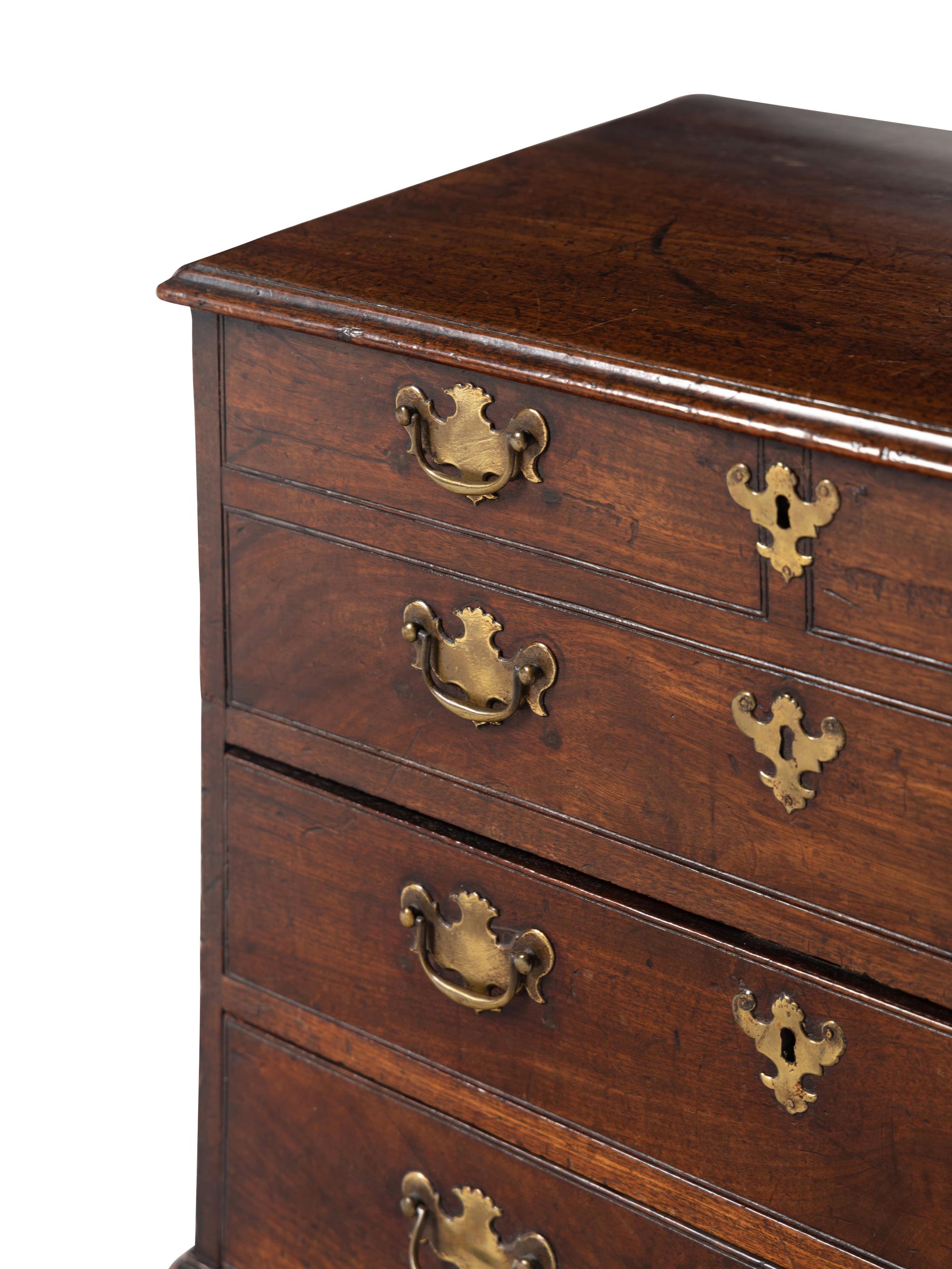 A George III Diminutive Lift-Top Chest of Drawers
