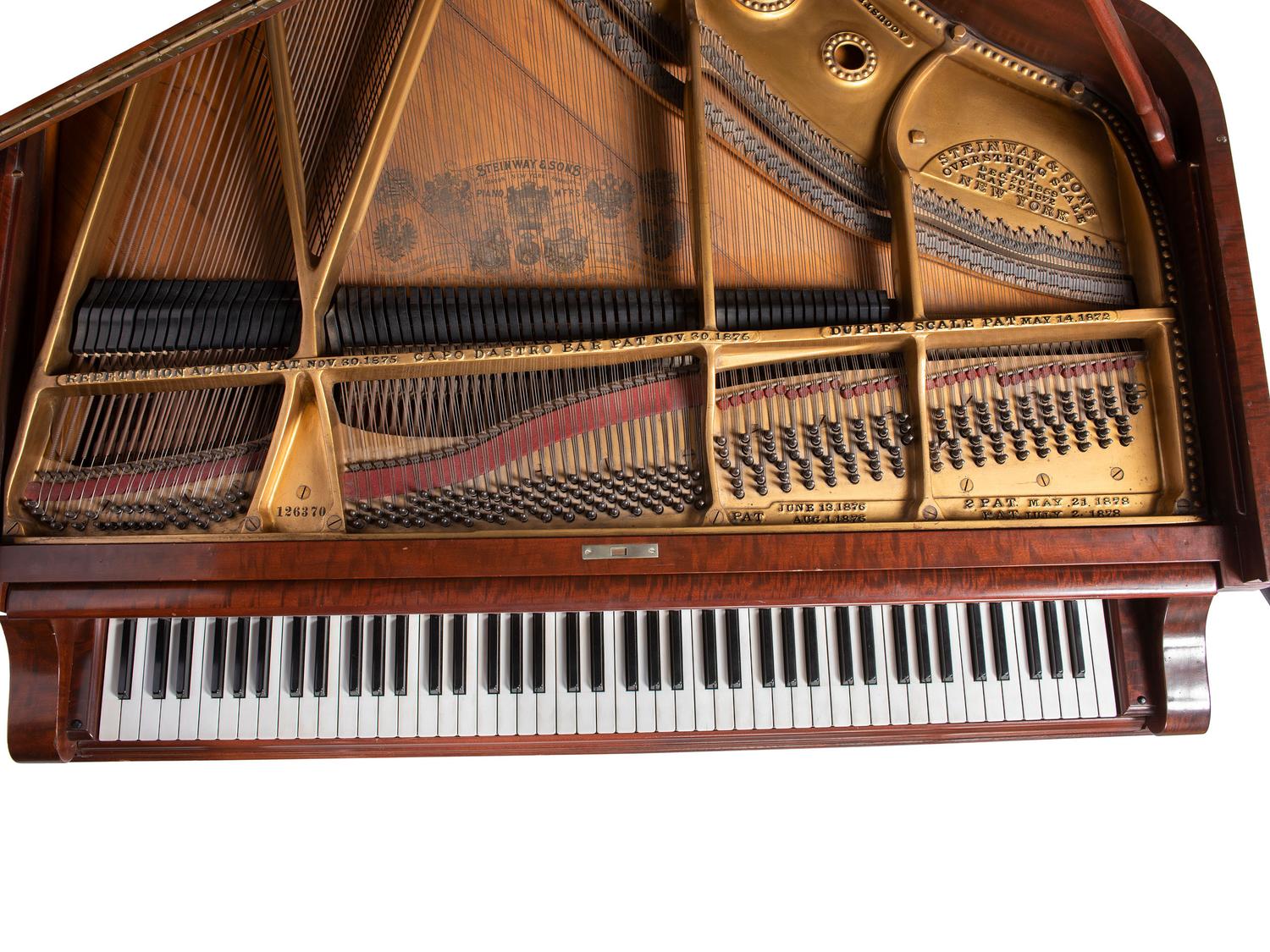 A Steinway and Sons Mahogany Baby Grand Piano