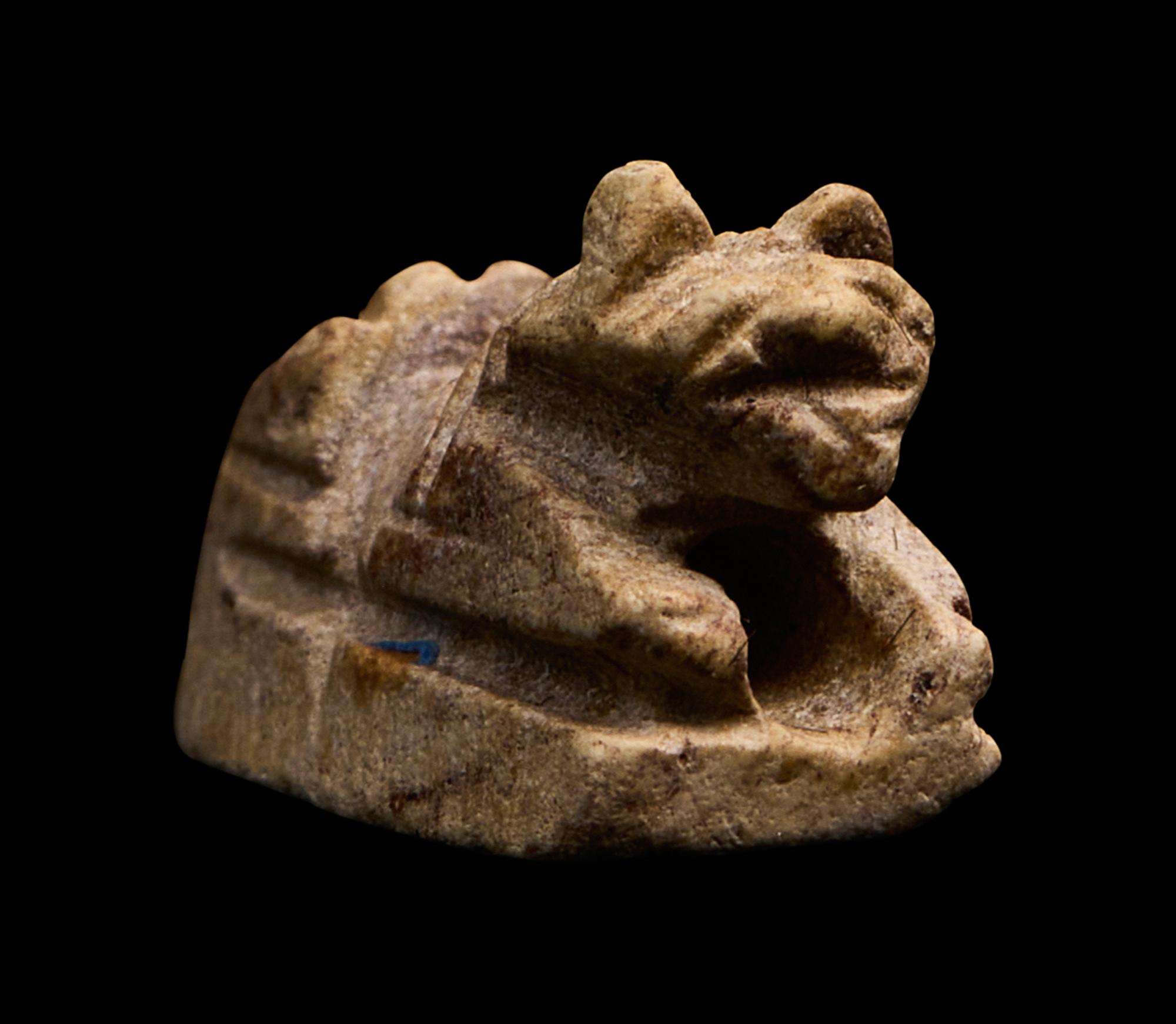An Egyptian Faience Recumbent Animal