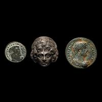 A Roman Silver Head and Two Roman Bronze Coins