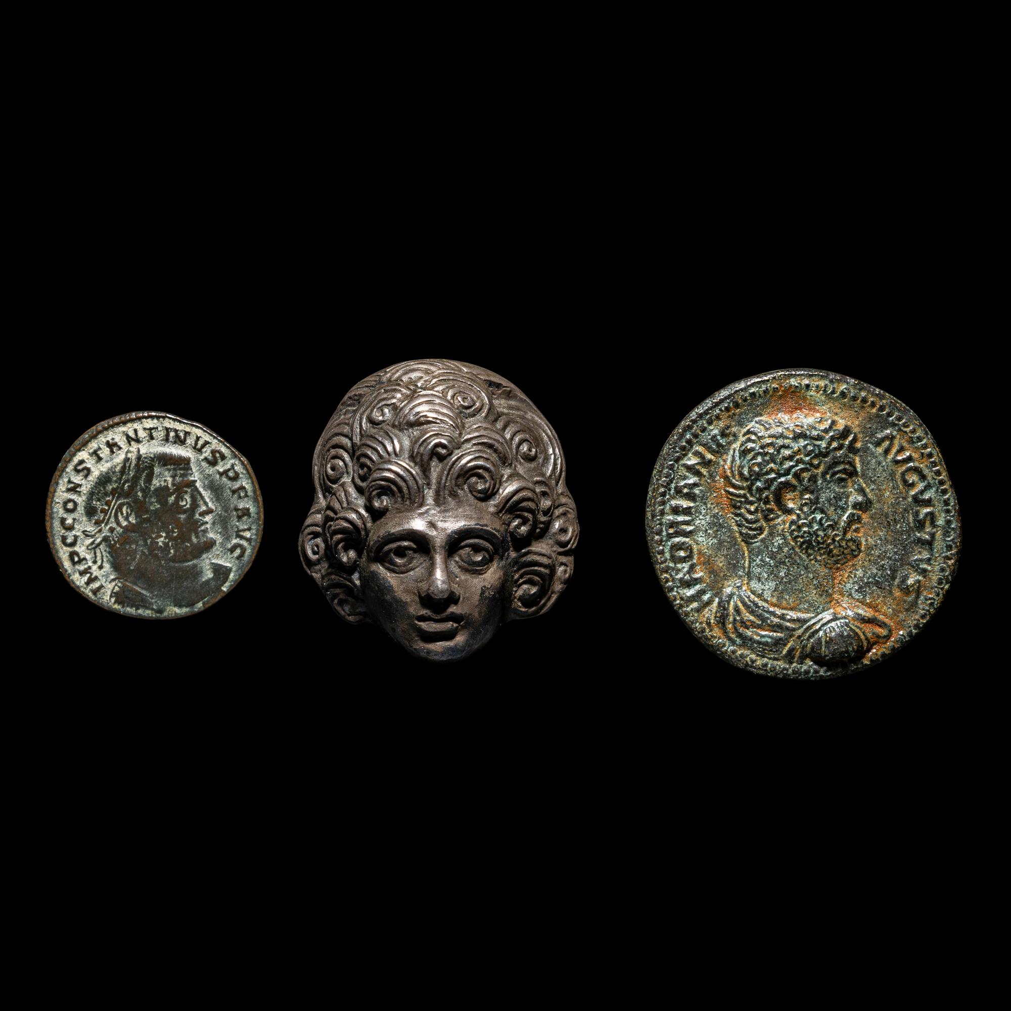 A Roman Silver Head and Two Roman Bronze Coins