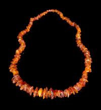 An Amber Beaded Necklace Length overall 18 1/2 inches.