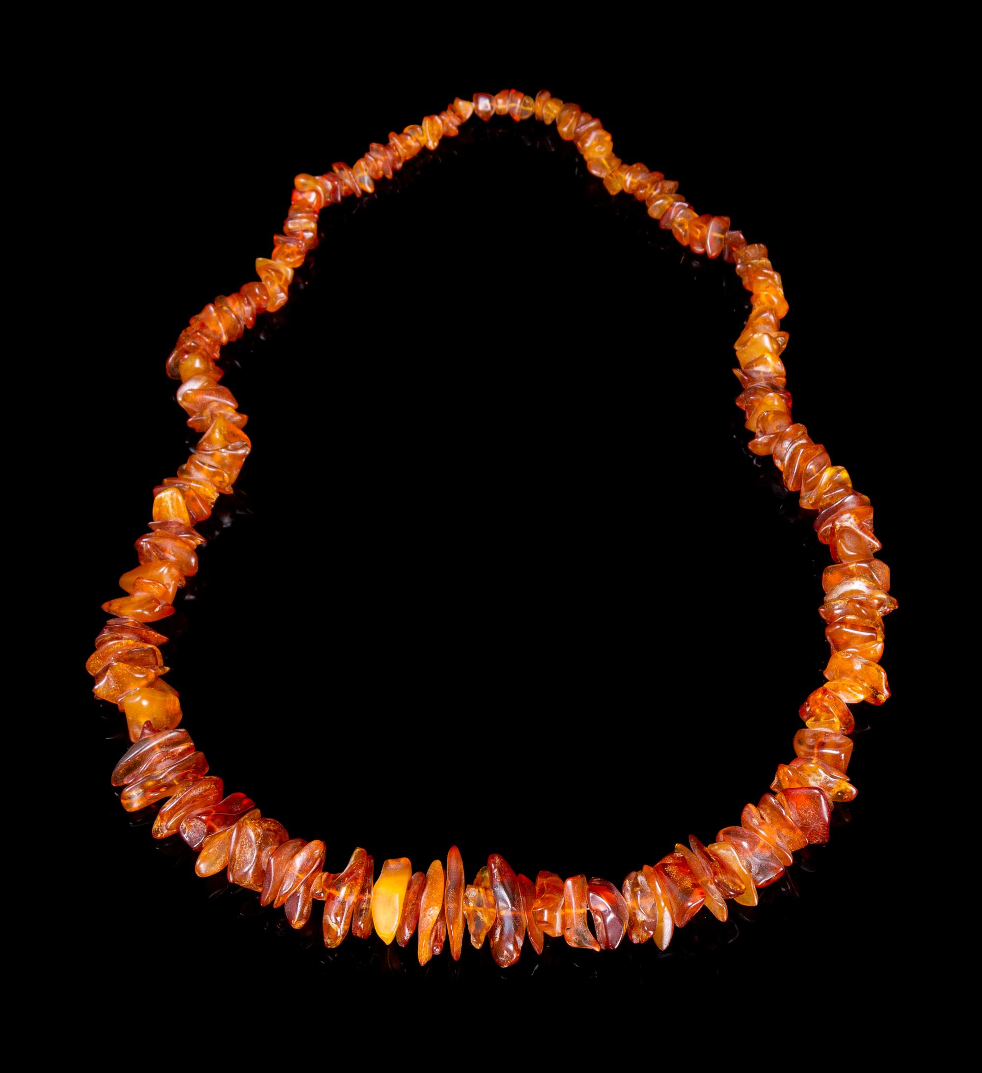 An Amber Beaded Necklace Length overall 18 1/2 inches.