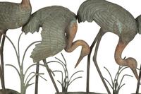 A Bronze Sculpture of Four Standing Cranes
