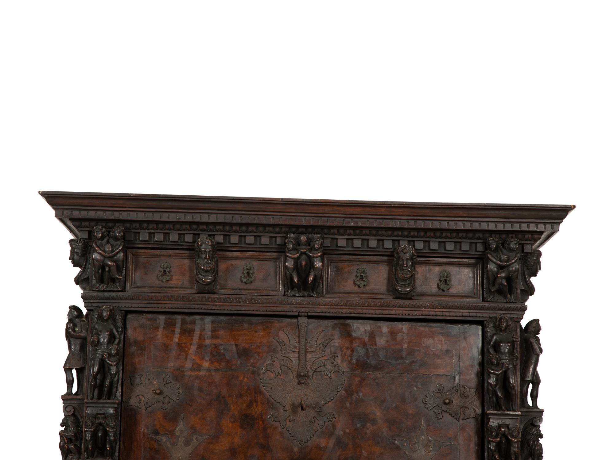 A Continental Baroque Walnut Cabinet