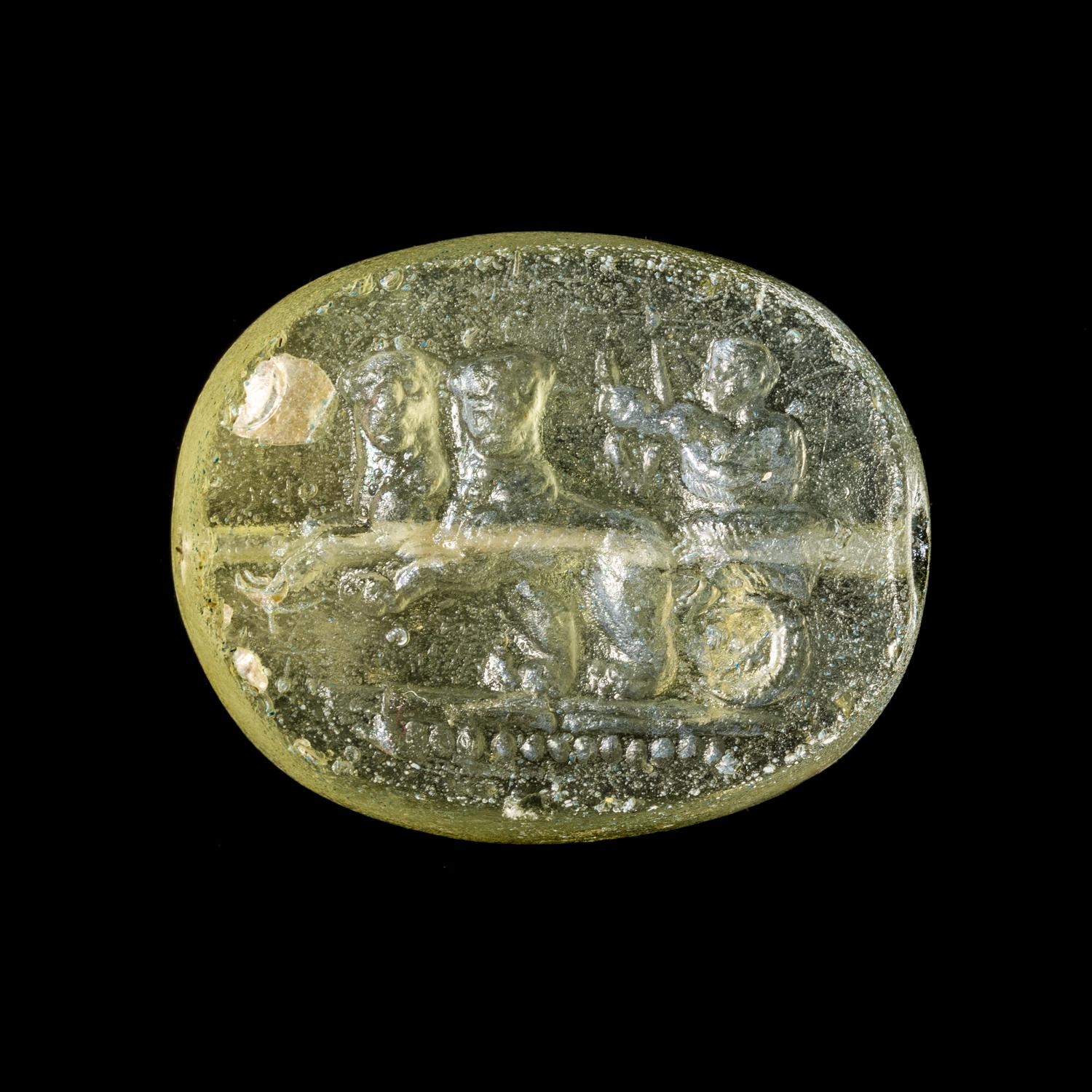 A Greek Glass Scaraboid with the God Dionysos Driving a Biga Chariot Pulled by Panthers
