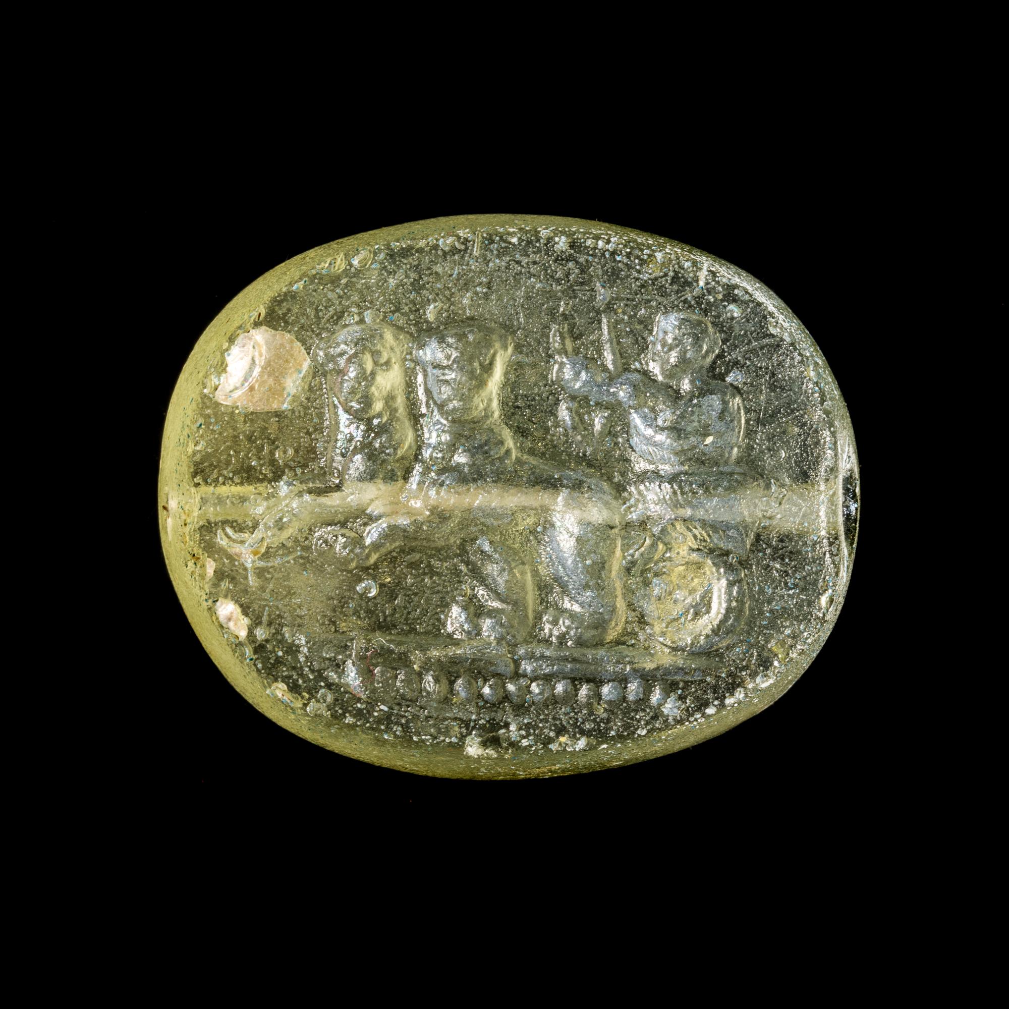 A Greek Glass Scaraboid with the God Dionysos Driving a Biga Chariot Pulled by Panthers