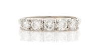 A 14 Karat White Gold and Diamond Band, 1.90 dwts.