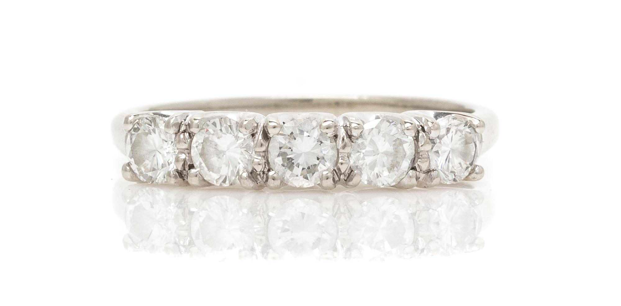 A 14 Karat White Gold and Diamond Band, 1.90 dwts.