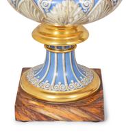 A Pair of Continental Parcel-Gilt and Polychrome Painted Porcelain Urns
