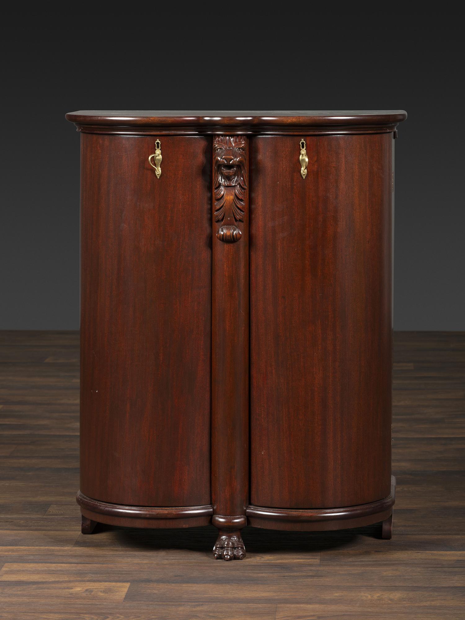 A Salter Double Bow-Front Lion Mask Carved Mahogany Record Cabinet