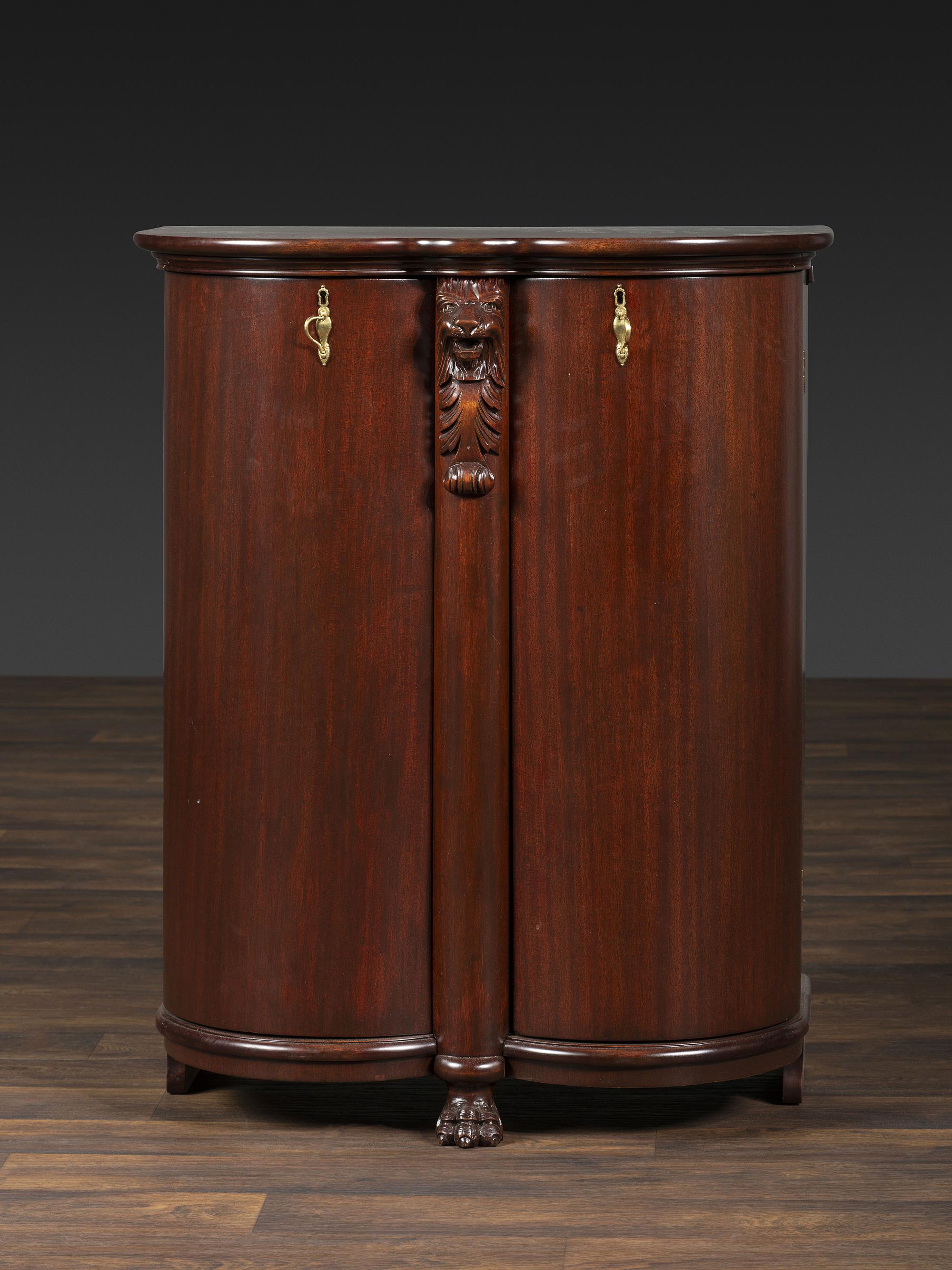 A Salter Double Bow-Front Lion Mask Carved Mahogany Record Cabinet