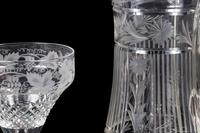A Collection of Cut and Etched Glass Stemware and a Pitcher