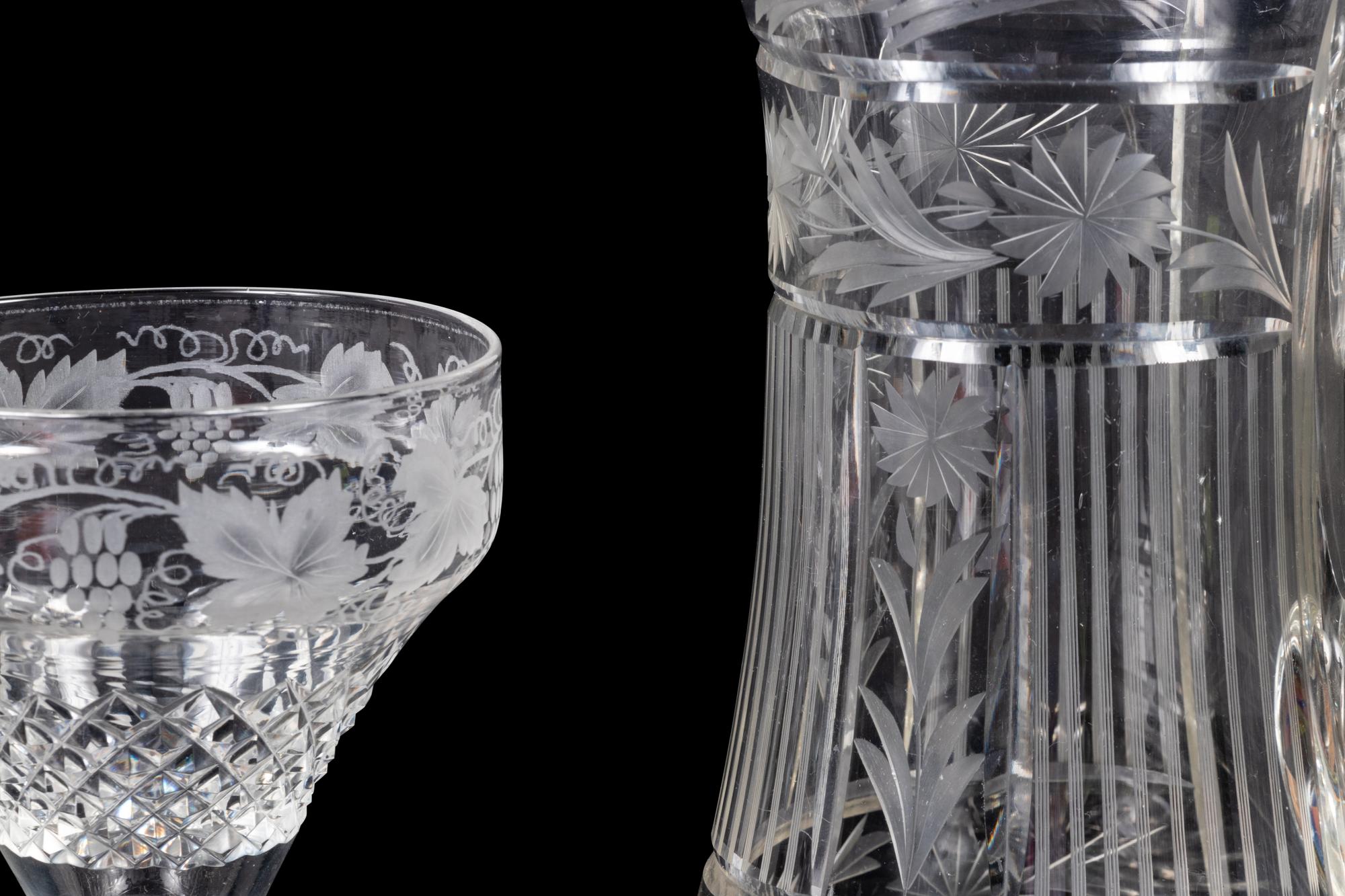 A Collection of Cut and Etched Glass Stemware and a Pitcher