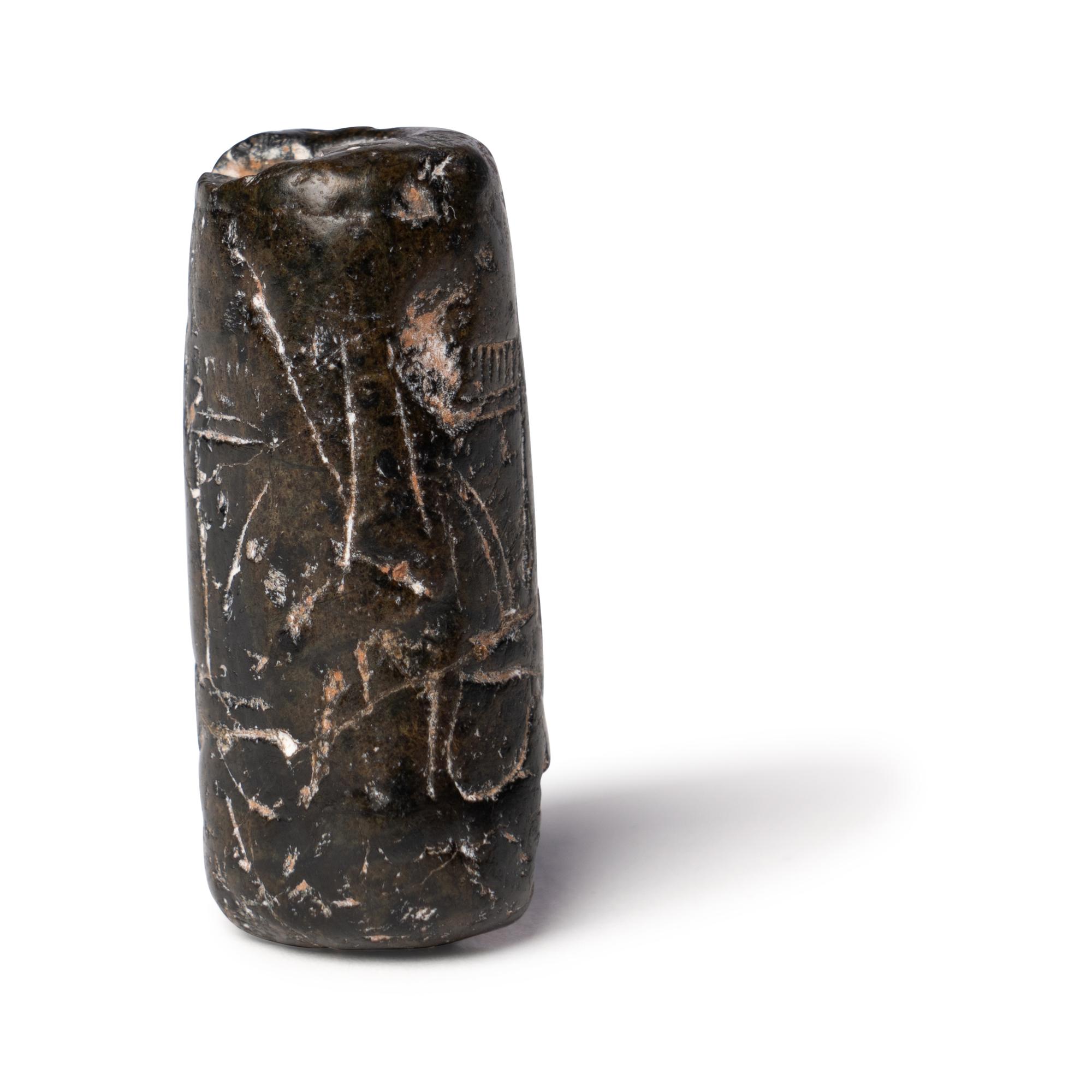 A Mesopotamian Black Steatite Cylinder Seal