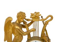 An Empire Gilt Bronze Figural Mantel Clock
