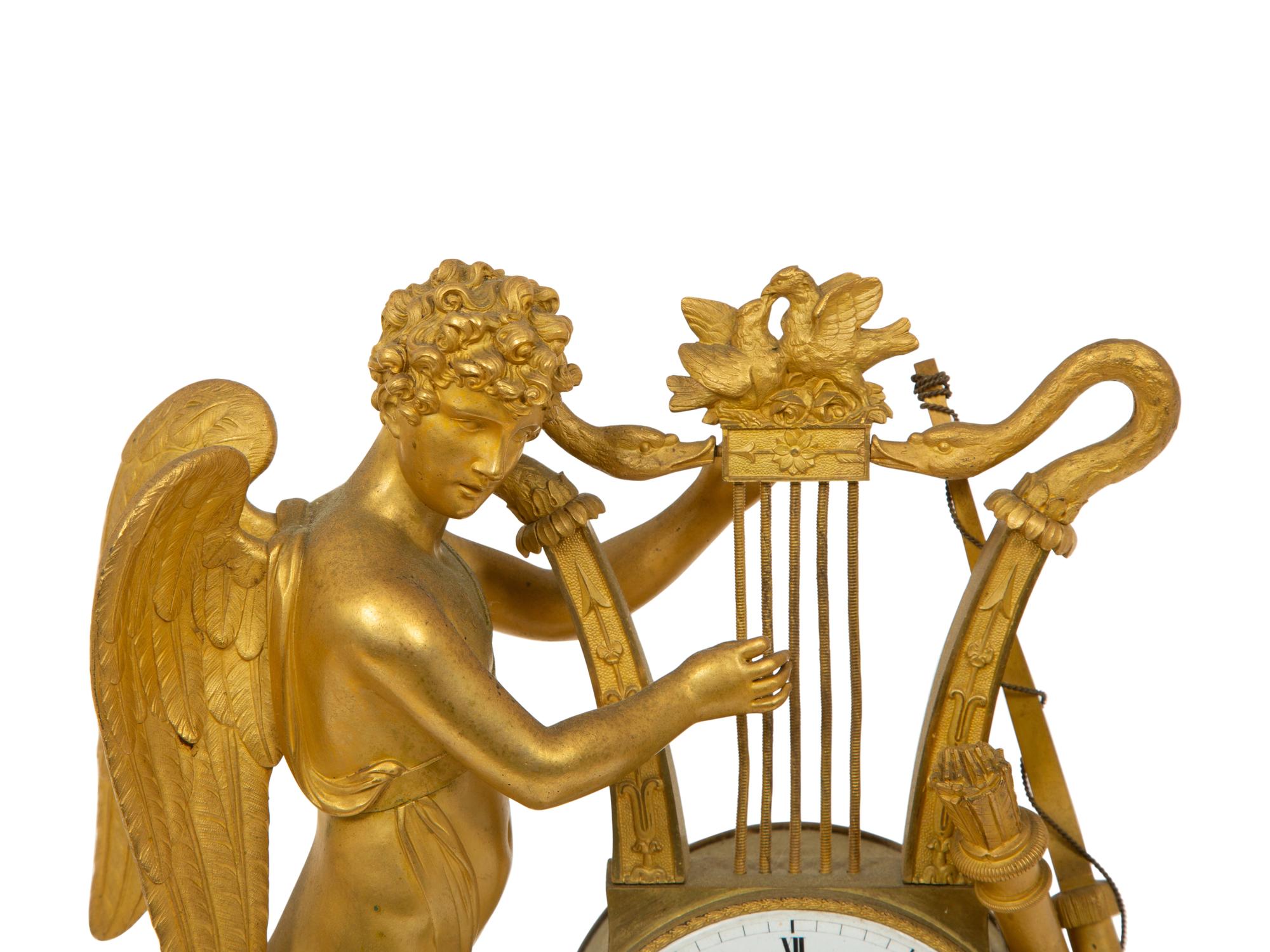 An Empire Gilt Bronze Figural Mantel Clock