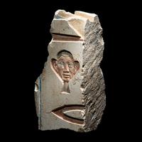 An Egyptian Painted Limestone Relief Fragment