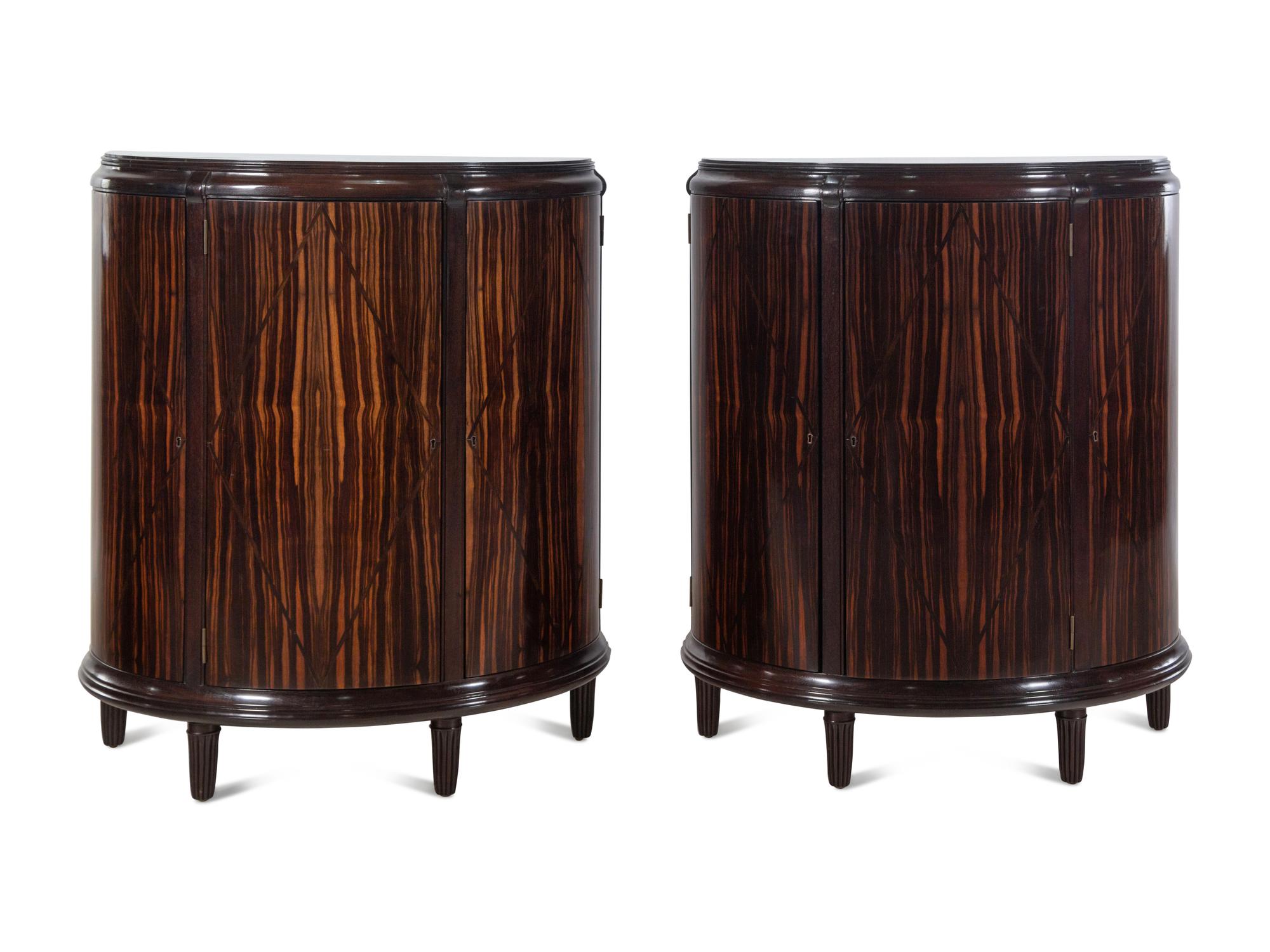 A Pair of Dessin Fournir Walnut and Banded Rosewood Demilune Cabinets