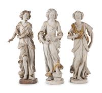 A Set of Three Carved, Painted and Parcel Gilt Wood Figures