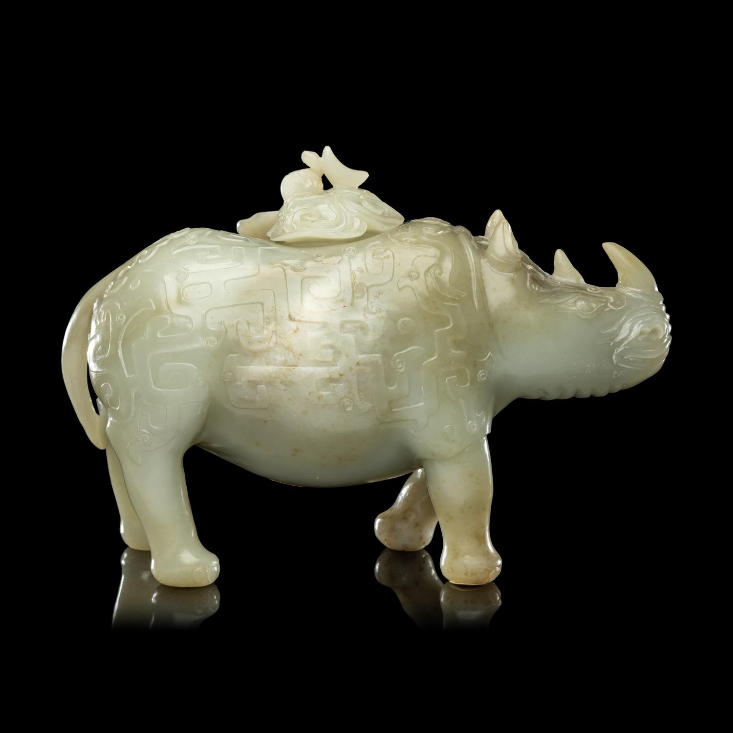 A Chinese Carved Celadon Jade Archaistic Rhinoceros-Form Covered Vessel, 20th Century 近代 青玉仿古犀尊